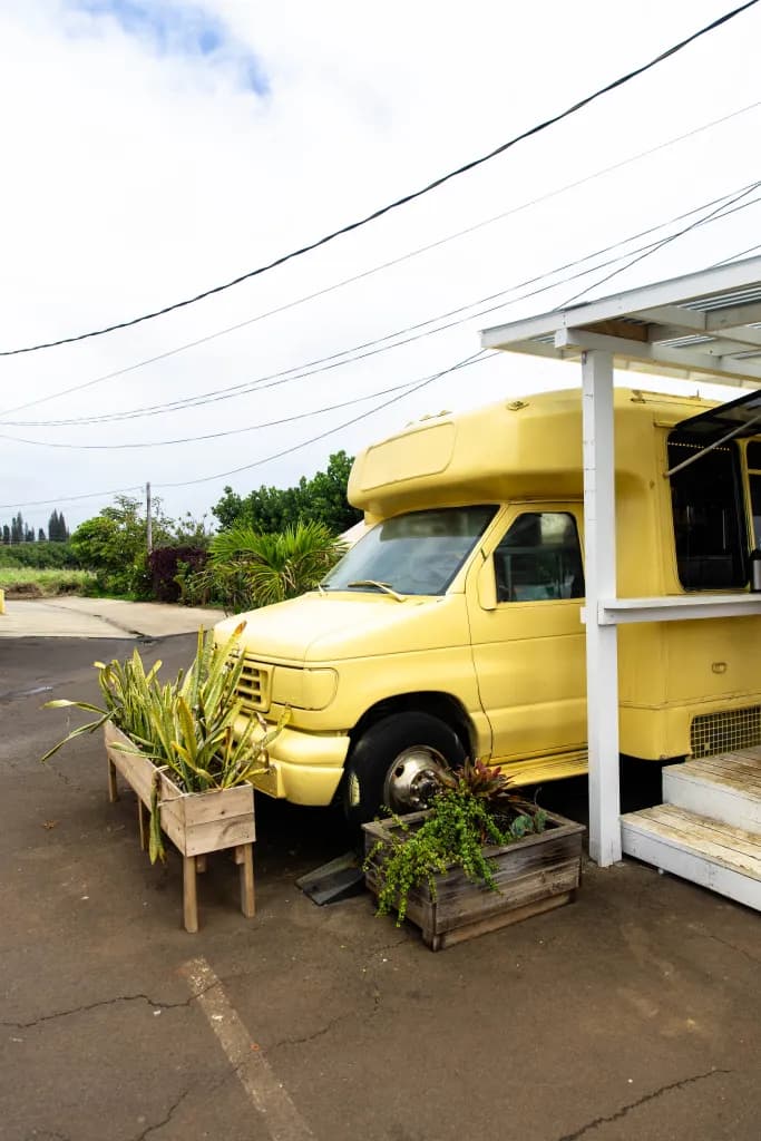Mokihana Coffee Co yellow bus exterior in Kapaa